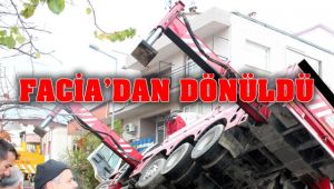 Zemin çökünce kalorifer kazanı vinçten düştü